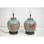 Pair of Jenny Worrall 'Rambling Rose' pattern glass table lamps, raised on wooden bases. Approx 55cm