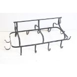 Large Wrought Iron Hanging Games Hooks having a horizontal hanging bar holding a rectangular frame