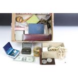 A box of mixed collectables to include vintage costume jewellery, medallions, badges, banknotes,