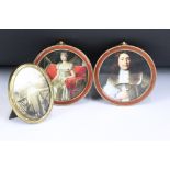 A pair of antique brass and enamel round frames together with another brass frame.