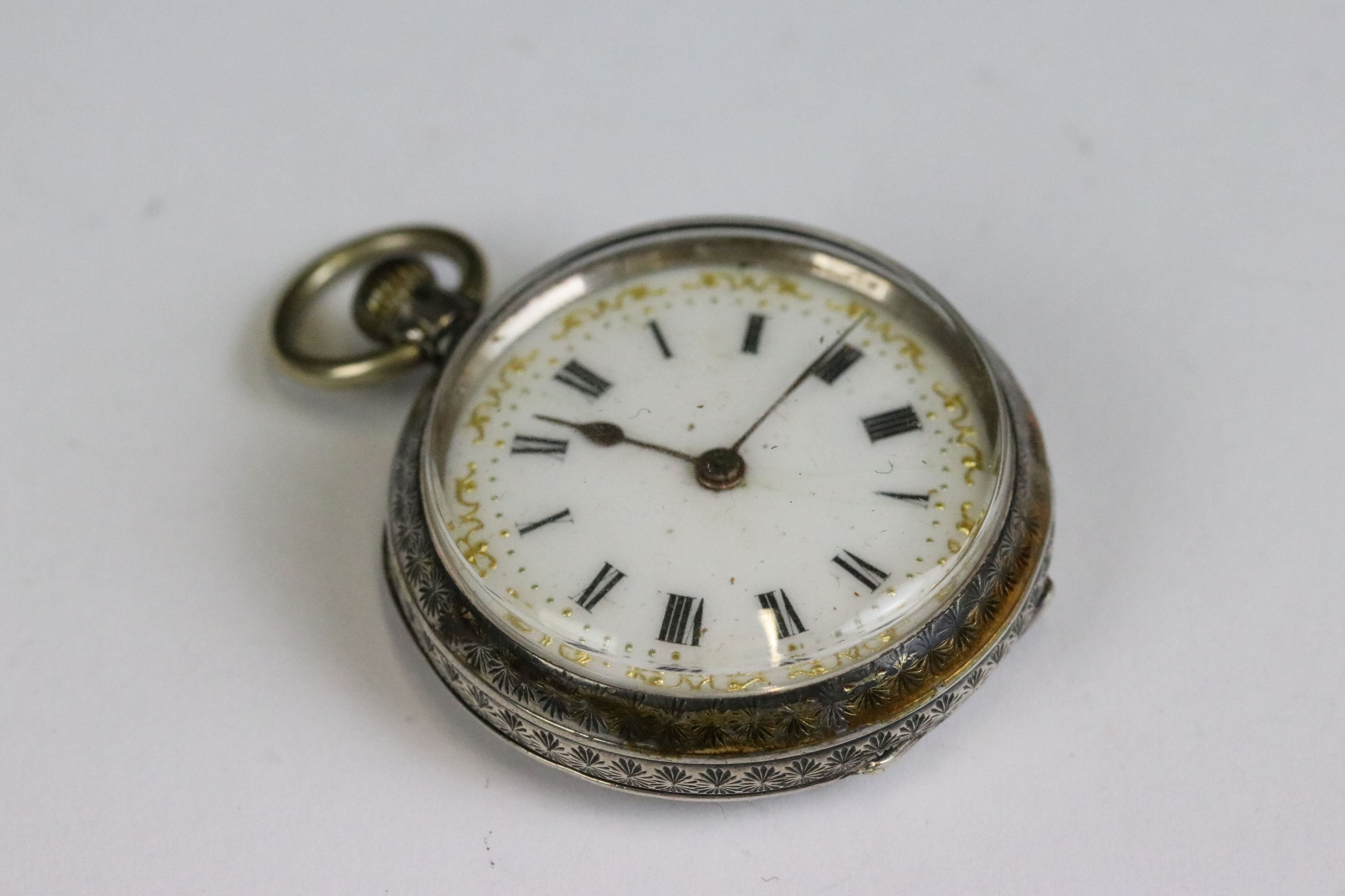 A collection of three silver cased ladies fob watches, two with enamel decoration to the dial. - Image 10 of 13