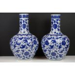 Near pair of Chinese blue & white bottle vases, with scrolling floral and foliate decoration, each