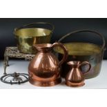 A collection of mixed brass and copper ware to include two brass preserve pans, two copper jugs