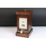 Railwayana - A Mid 20th C mahogany cased lamp repeater, with bell on/off switch. Measures approx