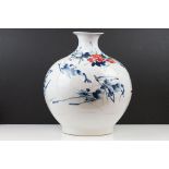 Chinese ceramic vase of ovoid form, with floral decoration in red & blue on a white ground, six