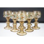 Set of six Bohemian green glass wine glasses, with enamelled floral decoration, applied floral