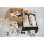A large collection of mainly British First Day Covers And PHQ cards contained within two boxes.