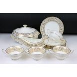 Wedgwood 'Gold Florentine' part dinner service for 6 (pattern no. W4219), to include 2 tureens &
