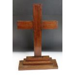 Wooden cross mounted on a stepped base, 59cm high