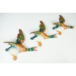 Set of three Beswick flying duck graduating wall plaques, model numbers 596-2, 596-3 & 596-4 (