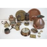 A collection of mixed metalware to include a ship lamp, miners lamps, copper jug, barometer, bell,