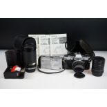 A small collection of photographic equipment to include an Olympus OM10 35mm SLR camera and a