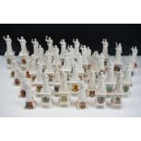 40 ceramic crested ware / goss figurines of Florence Nightingale, each with a town crest to the
