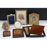 A collection of antique and vintage photograph frames to include two fully hallmarked silver