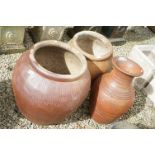 Three Large Garden Planters, two with a salt-glazed type finish, the other terracotta, largest