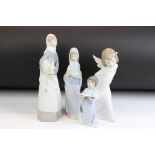 Group of four Lladro figurines to include an angel, girl with lamb, girl with lilies and a boy