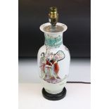 Chinese famille verte lamp base featuring immortals in a landscape scene with hand applied colours