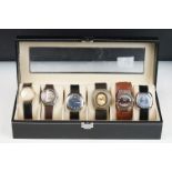 Watch display case containing six vintage gents watches