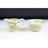 Clarice Cliff for Newport Pottery - an Art Deco matching cream jug and sugar bowl having hand