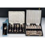 A cased set of six fully hallmarked sterling silver teaspoons together with a boxed silver