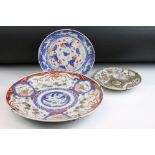 Group of three Oriental ceramic plates. The lot to include a Chinese Canton famille rose plate, a