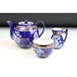 19th Century Victorian Macintyre tea set decorated with blue and white florals and gilt detailing.