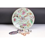 19th Century Chinese famille rose plate being hand decorated with birds of paradise to the centre