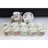 Set of twelve Royal Albert Flower of the Month tea cups and saucers. Each marked to the bases.