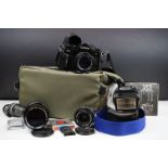 A Canon A-1 35mm SLR camera together with accessories to include lenses, Flash...etc.