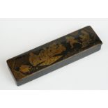 Japanese Black Lacquered Pen Box, the hinged lid with gilt chinoiserie decoration opening to two pen