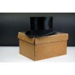 Early 20th century moleskin top hat with felt band, with cardboard hat box.