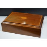 An early 20th century mahogany box with inlayed decoration.