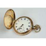 A 10ct gold plated full hunter pocket watch with white enamel dial and sub second dial to 6 o'clock.