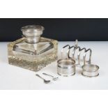 An early 20th century cut glass inkwell with sterling silver top together with a sterling silver