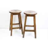 Pair of oak high stools with dished seats, 73cm high