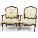 Pair of French Louis XV style Carved Walnut Framed Fauteils / Elbow Chairs, upholstered in