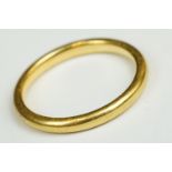 A fully hallmarked 22ct gold wedding band.