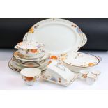 Art Deco Gray's Pottery dinner service having hand painted orange and blue floral decoration. To