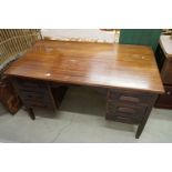 Mid century Mahogany Office Desk with two slides and an arrangement of five drawers with block