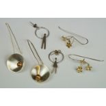 A collection of three pairs of 925 sterling silver earrings to include gilt poppy examples.