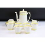 Art Deco Crown Ducal coffee set having a yellow striped design with silver gilt details. To
