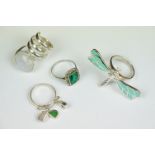 A collection of four 925 sterling silver rings to include a Dragonfly example with articulated