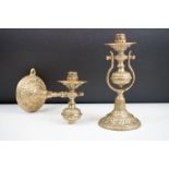 A pair of brass standing or wall mounted candlesticks with gimble mounting.