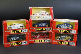 Seven boxed Matchbox SCX slot cars to include Volvo 850T (83920.20), Bugatti (83870.20 - missing