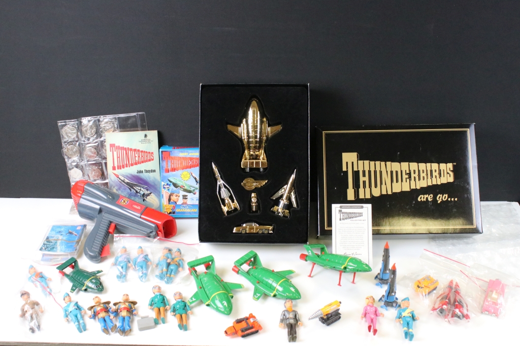 Quantity of Gerry Anderson related items to include Thunderbirds figures, Captain Scarlet ray gun,