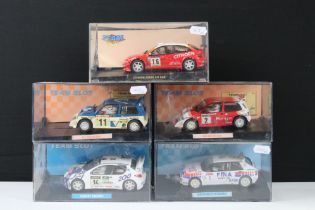 Five cased 'Team Slot' slot cars to include 11001 Peugeot 206 WRC "Tour De Corse '99", 11204