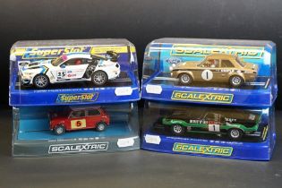 Four cased Scalextric slot cars to include C2920 Ford Escort RS 1600 No 1, C3612 Chevrolet Camaro
