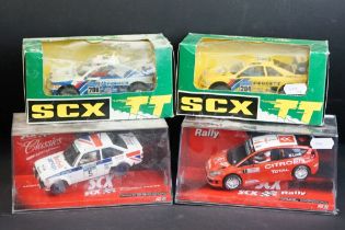 Four boxed / cased SCX slot cars to include 2 x SCX TT 4x4 Racing System (73020 Peugeot 405 "