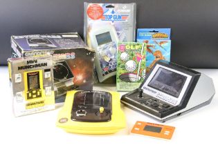 Retro Gaming - Eight handheld consoles to include boxed Grandstand Mini Munchman, boxed