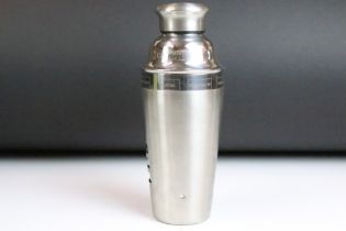 Art Deco style Stainless steel cocktail shaker having rotating case which lists cocktail recipes.